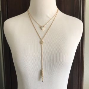 Layered drop pendant necklace.